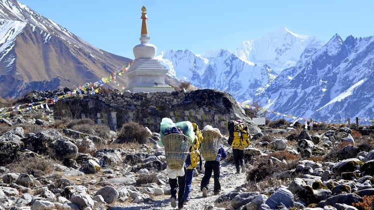 Budget travelers hiking on a mountain in Nepal which is one of the cheapest destinations in South Asia