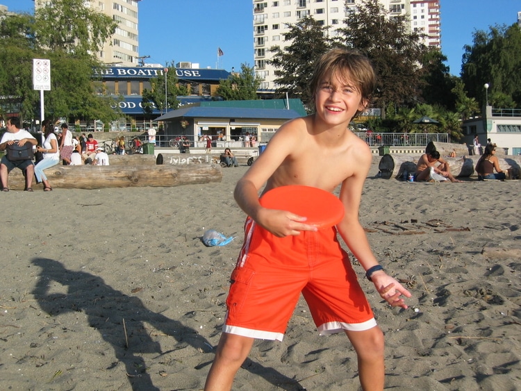 Sebastian from Travel Done Simple as seen on the beach in Vancouver Canada